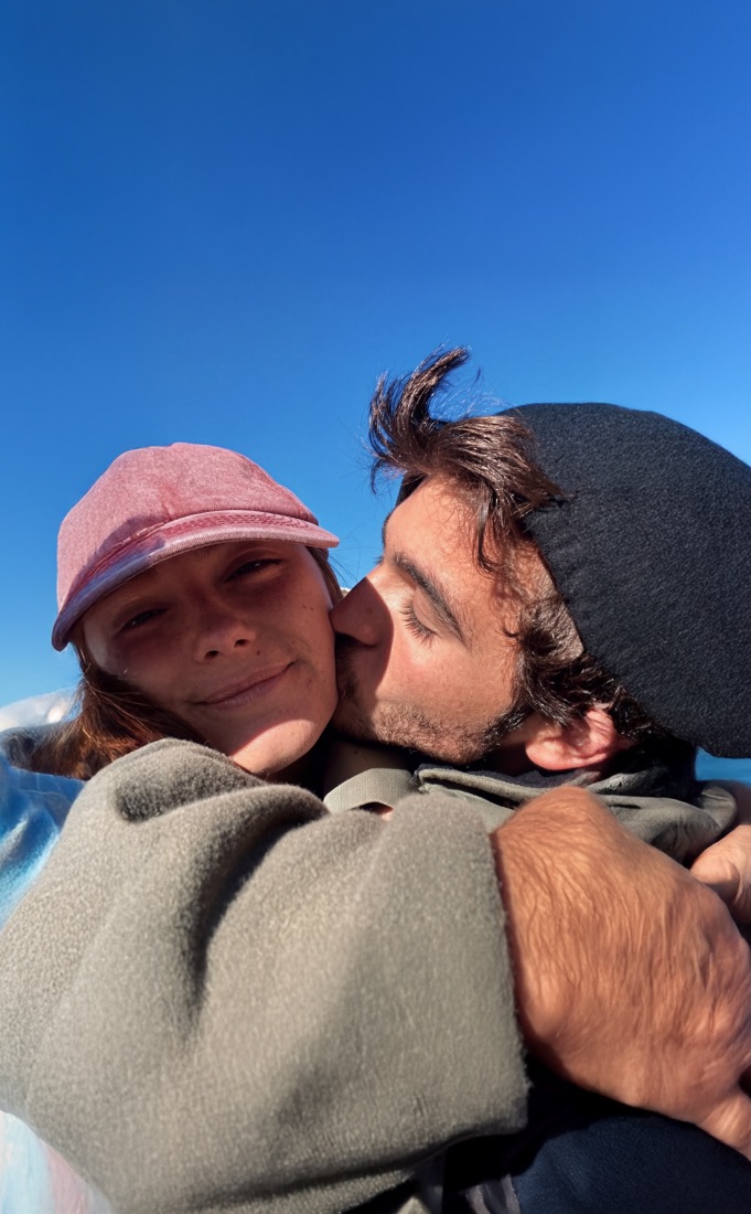A couple kissing outdoors